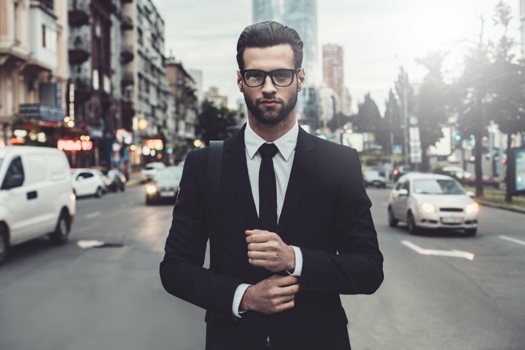 Human capital risk - a business man standing in traffic